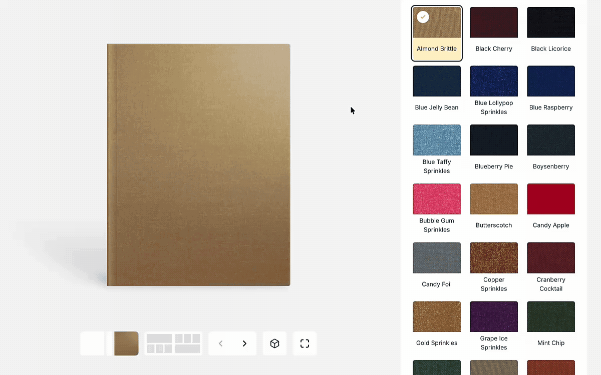 A digital album design interface showing a square photo album with a textured ‘Almond Brittle’ cover selected. On the right, a grid of colorful cover material options is displayed, including shades of blue, red, gold, and textured finishes, allowing users to preview and choose different album cover styles.